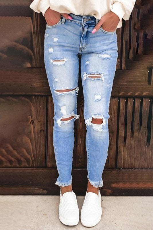 MID RISE LIGHT BLUE RIPPED JEANS